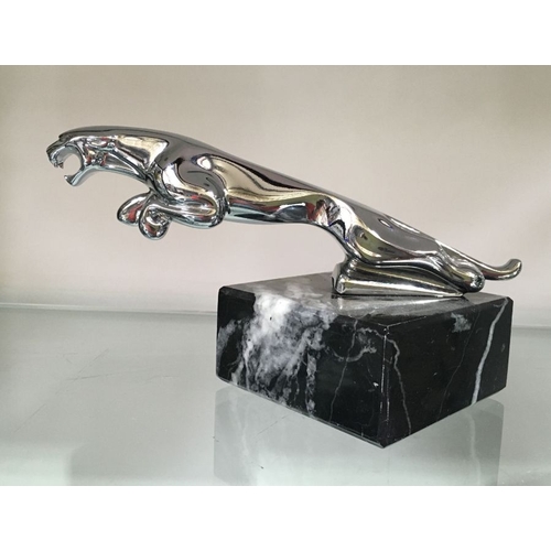 453 - A chromed Jaguar car mascot, on marble base