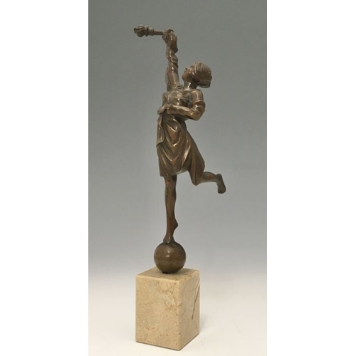 469 - A bronze figure of a torch holder, modelled standing on a ball, block base, 36cm high