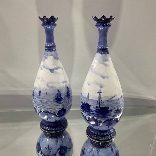 497 - W E J Dean attributed for Royal Crown Derby, a pair of blue and white marine painted vases, footed b... 