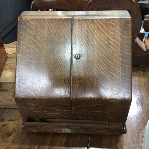 543 - An Edwardian oak desk top stationary cabinet, with incorporated desk calendar, letter rack and pen t... 