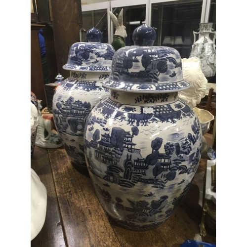 550 - A large pair of Chinese style jars and covers, painted will pattern decoration, 60cm high (2)