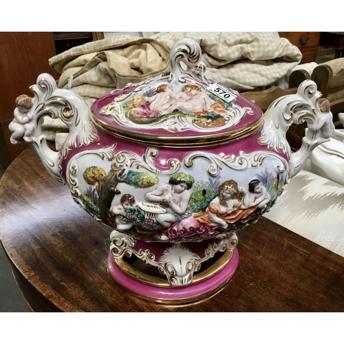 570 - A large Capodimonte relief moulded tureen and cover, modelled with cherubs and figures, 45cm long