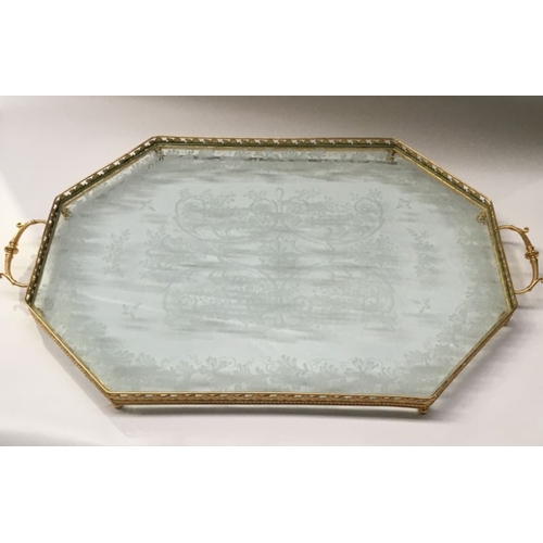 571 - A large gilt metal and glass tray together with a chromed glass example  65cm long  (2)