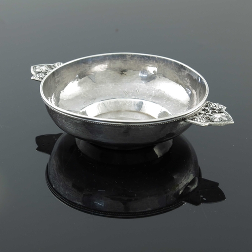 115 - Edward Spencer for the Artificers Guild, an Arts and Crafts twin handled porringer, London 1931, pla... 