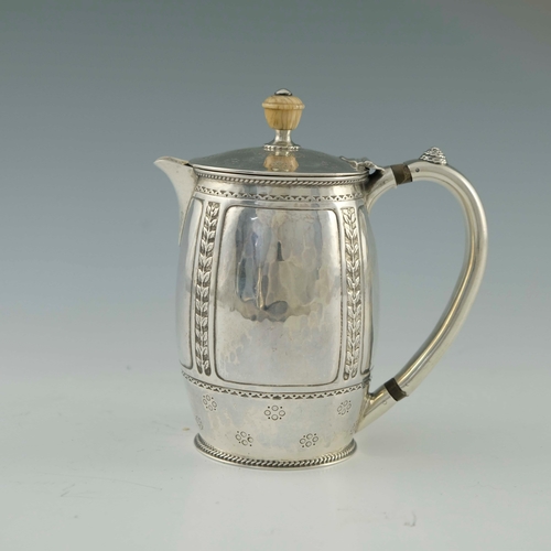 118 - Bernard Cuzner for Liberty and Co., an Arts and Crafts silver lidded jug, Birmingham 1919, barrel fo... 