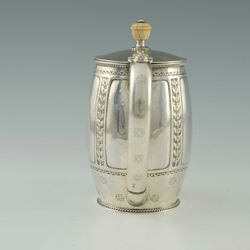 118 - Bernard Cuzner for Liberty and Co., an Arts and Crafts silver lidded jug, Birmingham 1919, barrel fo... 