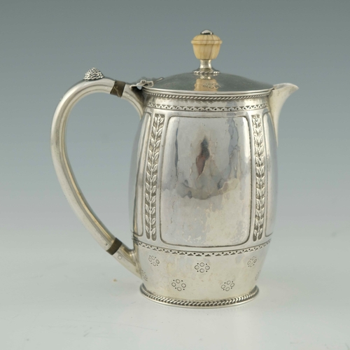 118 - Bernard Cuzner for Liberty and Co., an Arts and Crafts silver lidded jug, Birmingham 1919, barrel fo... 