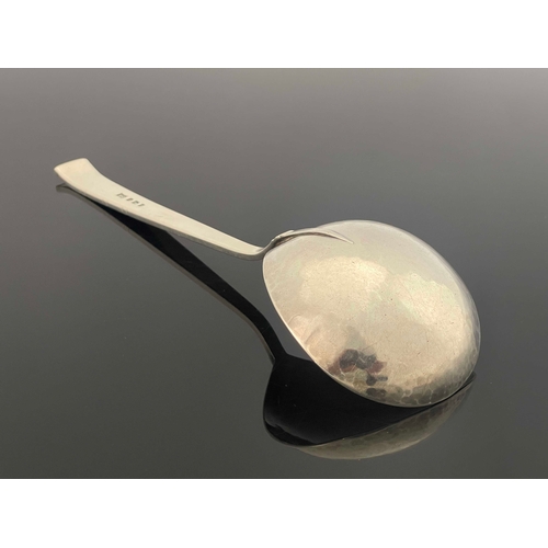 120 - Bernard Cuzner, a large Arts and Crafts silver spoon, London 1943, planished ladle form bowl, incise... 