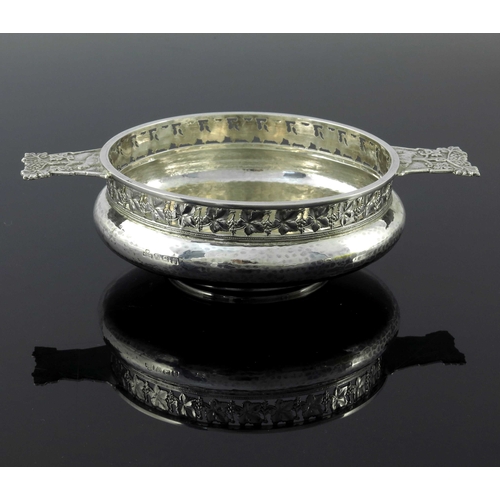 122 - An Arts and Crafts silver porringer, G L Connell, Birmingham 1926, planished, squat bulbous form, th... 