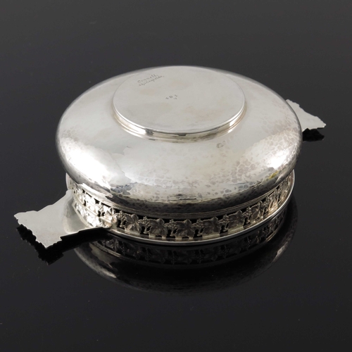 122 - An Arts and Crafts silver porringer, G L Connell, Birmingham 1926, planished, squat bulbous form, th... 