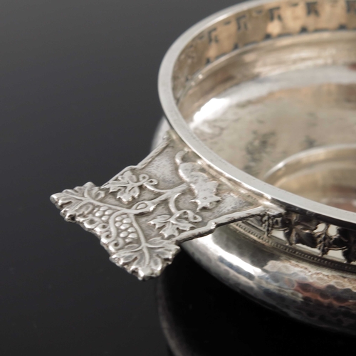 122 - An Arts and Crafts silver porringer, G L Connell, Birmingham 1926, planished, squat bulbous form, th... 