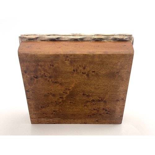 124 - An Arts and Crafts burr wood and white metal box, in the Omar Ramsden style, cushion topped cuboid f... 