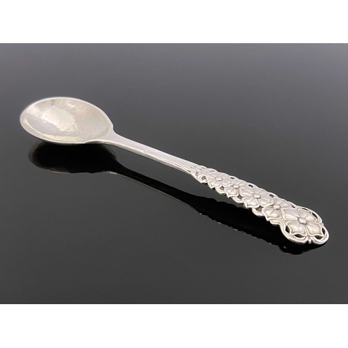 127 - Omar Ramsden, an Arts and Crafts silver spoon, London 1926, planished, cast and pierced dogwood flow... 