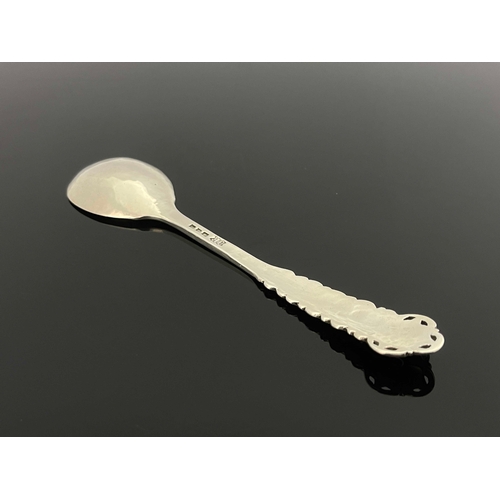 127 - Omar Ramsden, an Arts and Crafts silver spoon, London 1926, planished, cast and pierced dogwood flow... 