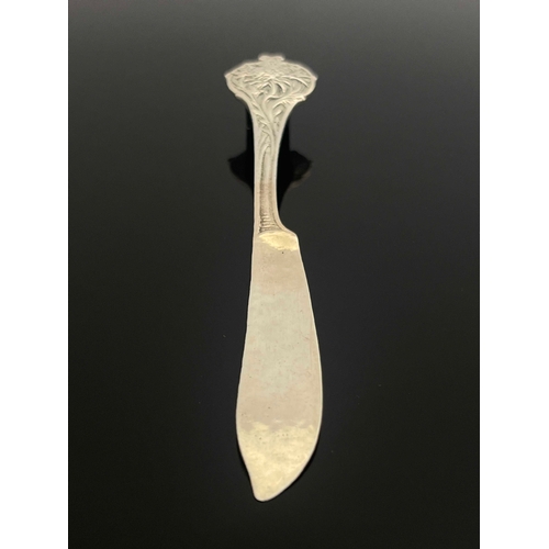 130 - Omar Ramsden, an Arts and Crafts silver butter knife, London 1930, planished, cast with a thistle ha... 