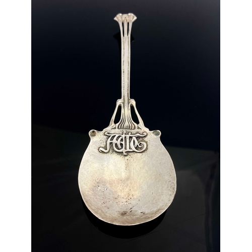 132 - Omar Ramsden and Alwyn Carr, a large Arts and Crafts silver spoon, Ramsden and Carr, London 1902, th... 