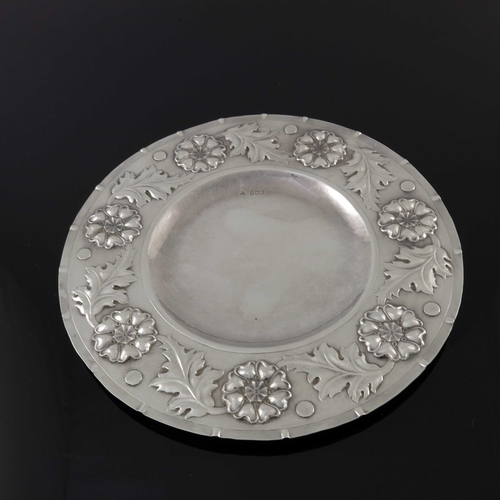 138 - An Arts and Crafts silver broad rimmed dish, William George Connell, London 1901, planished and repo... 