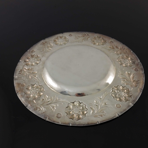 138 - An Arts and Crafts silver broad rimmed dish, William George Connell, London 1901, planished and repo... 