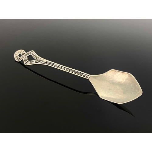 145 - An Arts and Crafts silver preserve spoon, Helen Holmes, Chester 1942, cast with an open knotted cord... 