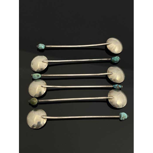 149 - A set of six Arts and Crafts turquoise and white metal coffee spoons, circa 1920, each with circular... 