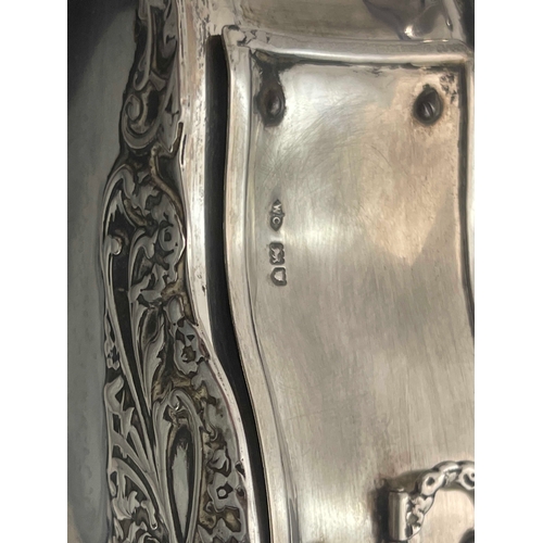 152 - An Arts and Crafts silver sardine server, Enid Kelsey, London 1938, planished shovel form, with a pi... 