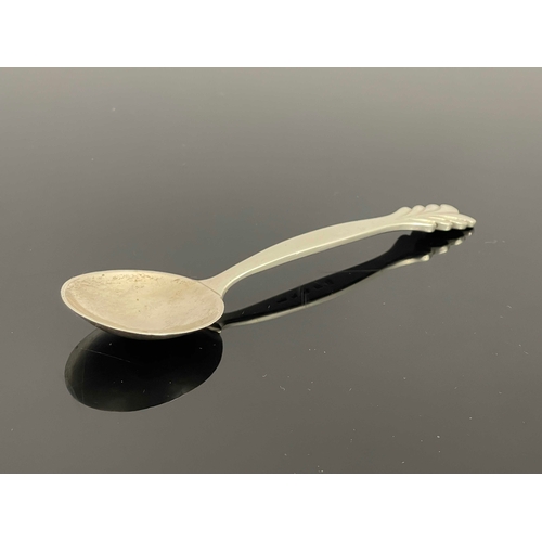 164 - H G Murphy, an Arts and Crafts silver spoon, Falcon Studio, London 1936, the planished bowl on a bow... 