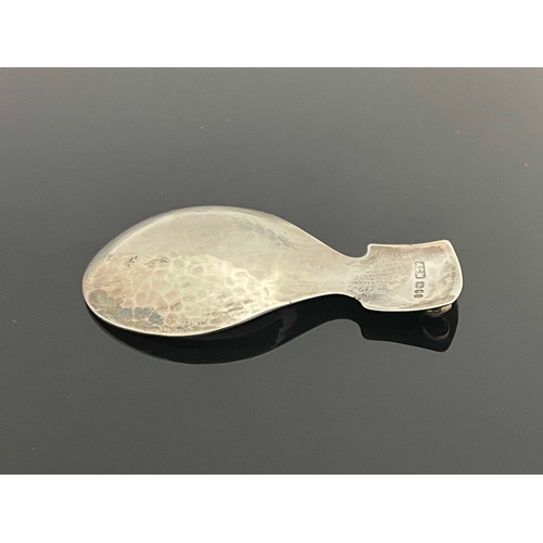 176 - A Modernist silver and gem set caddy spoon, ACW, London 1979, planished, the rectangular handle set ... 