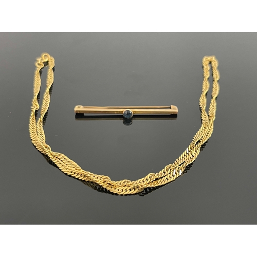 178 - A 9ct gold chain, together with a 9ct gold and sapphire tie pin, 7.1g (2)