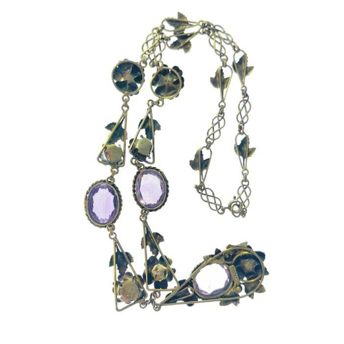 182 - An Arts and Crafts silver gilt and amethyst necklace, the central drop pendant with oval stone in ro... 