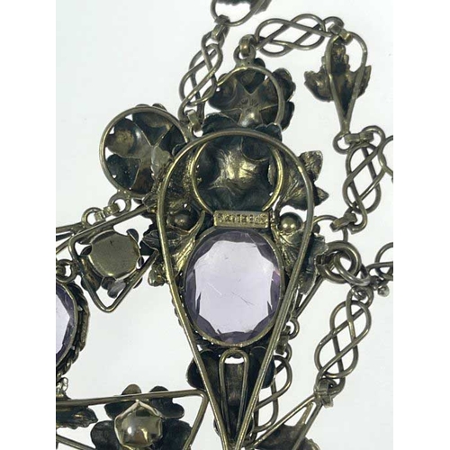 182 - An Arts and Crafts silver gilt and amethyst necklace, the central drop pendant with oval stone in ro... 