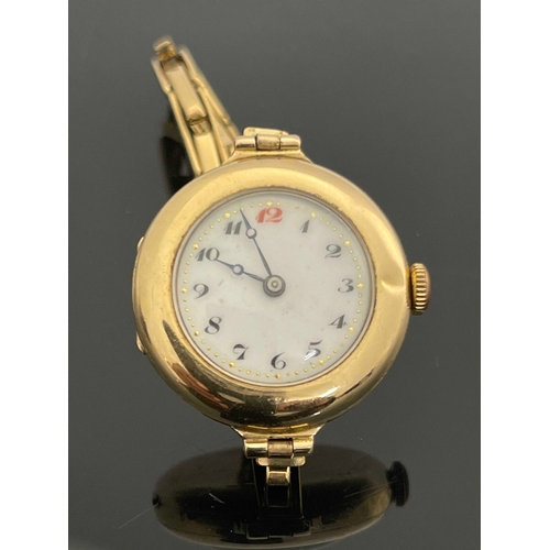 188 - A 9 carat gold ladies wristwatch, on plated link strap, 3cm diameter