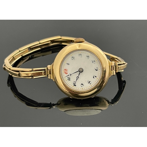 188 - A 9 carat gold ladies wristwatch, on plated link strap, 3cm diameter