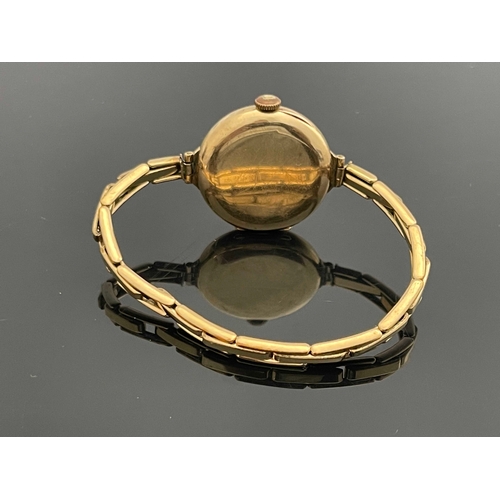 188 - A 9 carat gold ladies wristwatch, on plated link strap, 3cm diameter