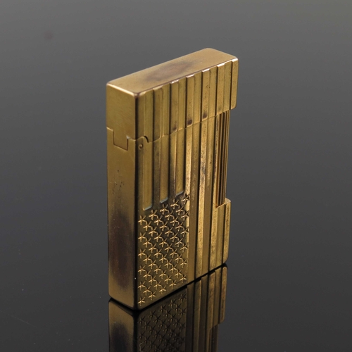 191 - S T Dupont, a gold plated American Flag lighter, relief moulded stars and stripes to each side, 6cm ... 