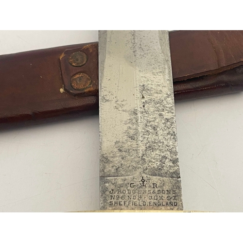 208 - An early 20th century Bowie knife, 8 inch blade stamped GR J. Rodgers & Sons no 6 Norfolk St Sheffie... 