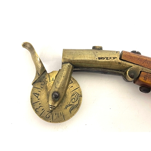 211 - A 19th century eprouvette/powder measure, brass wheel gauge and barrel stamped Woole?, with wooden h... 