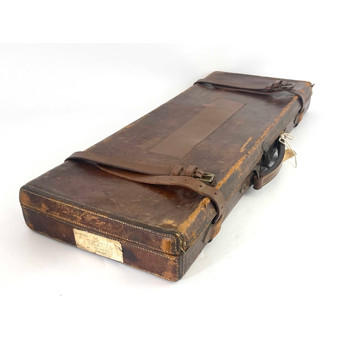 213 - A late 19th/early 20th century leather bound gun case, Bofs & Co London, the carcass covered in tool... 