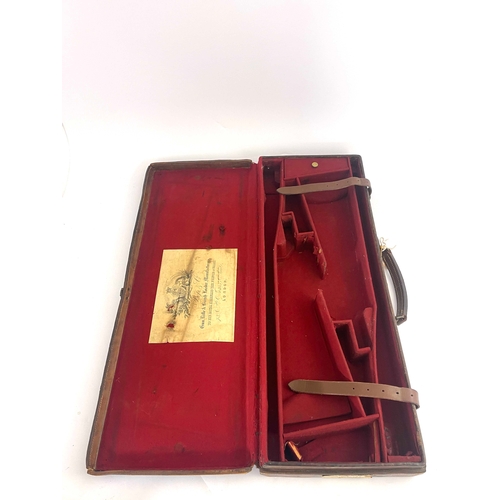 213 - A late 19th/early 20th century leather bound gun case, Bofs & Co London, the carcass covered in tool... 