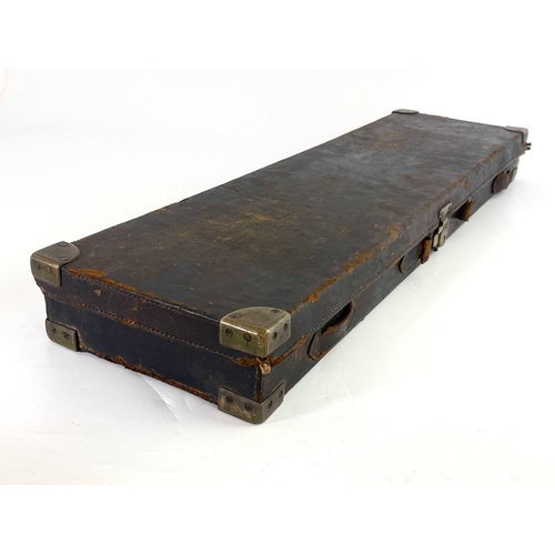 216 - A late 19th/early 20th century leather bound gun case, Cogswell & Harrison, the carcass covered in t... 