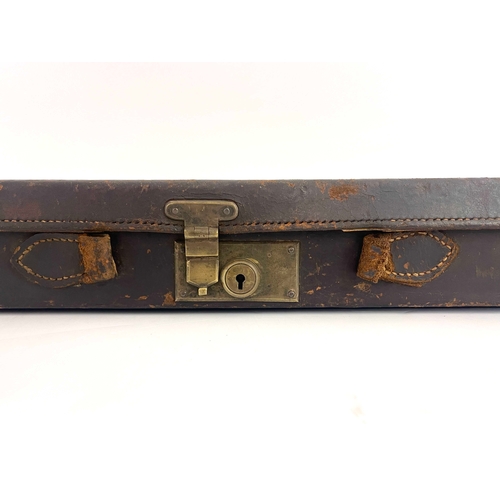 216 - A late 19th/early 20th century leather bound gun case, Cogswell & Harrison, the carcass covered in t... 