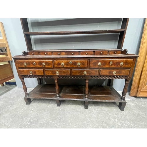 227 - A George III country oak dresser, circa 1770 and later, triple tier plate rack with plain cornice, m... 