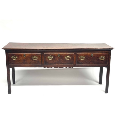 228 - A George III country oak standing dresser, circa 1770, moulded top, triple frieze drawers with fretw... 