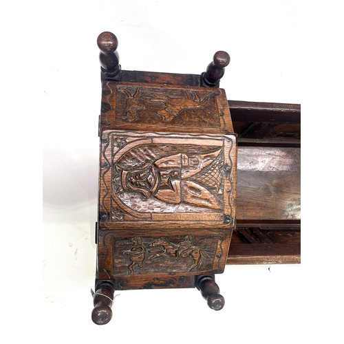 229 - A Charles II oak child's cradle, circa 1680 and later, hinged canopy, turned finials, carved with pa... 