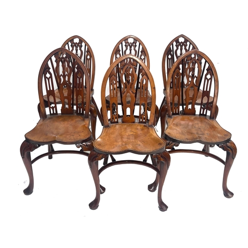 233 - Stuart Linford, a bespoke set of eight burr elm dining chairs, (two carvers), Gothic arched backs wi... 