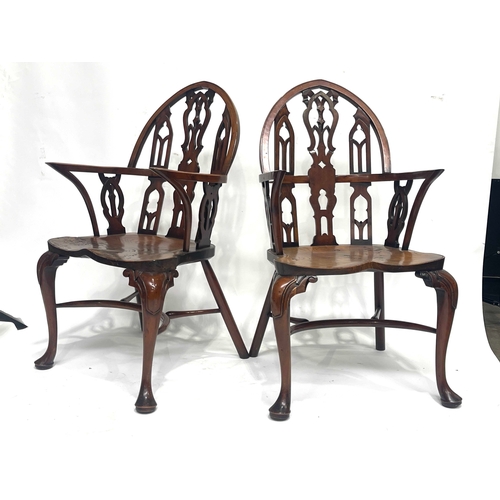 233 - Stuart Linford, a bespoke set of eight burr elm dining chairs, (two carvers), Gothic arched backs wi... 