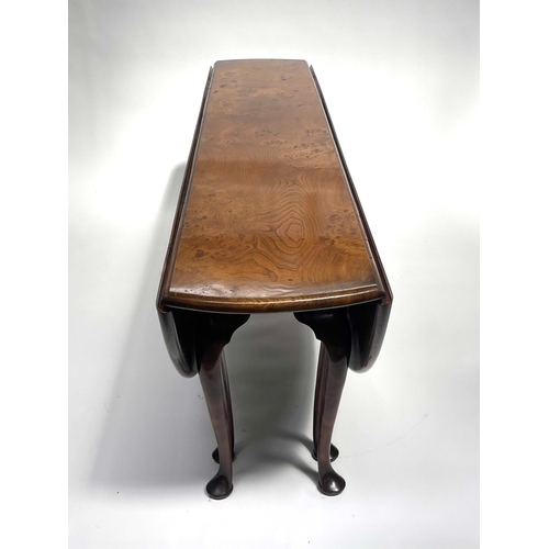 234 - Stuart Linford, a bespoke burr elm wake table, broad top with twin oval drop flaps, eight gateleg ac... 