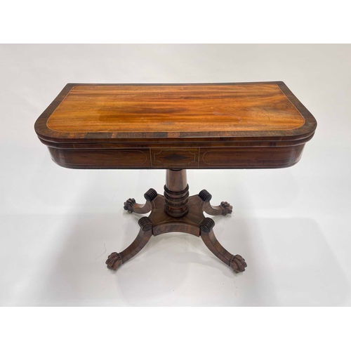 240 - A Regency mahogany pedestal games table, circa 1820, mahogany crossbanded and brass strung throughou... 