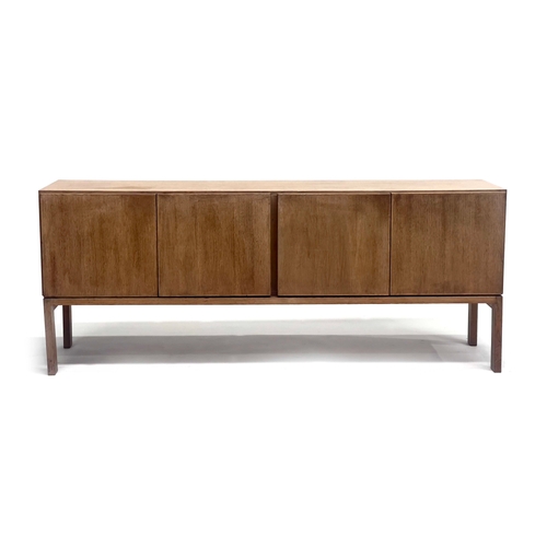 256 - Gordon Russell, a GR69 oak dining suite, late 1960s, comprising four door sideboard designed by Robe... 