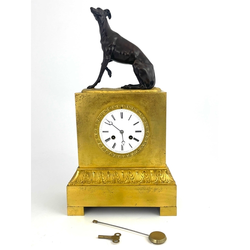 275 - A French ormolu bracket clock, circa 1870, surmounted with a bronze model of a seated greyhound, whi... 