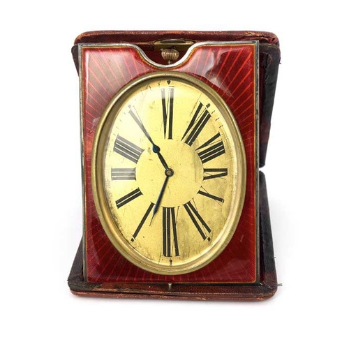 277 - An easel travel timepiece, early 20th Century, red leather outer case, oval gilt dial with Roman num... 